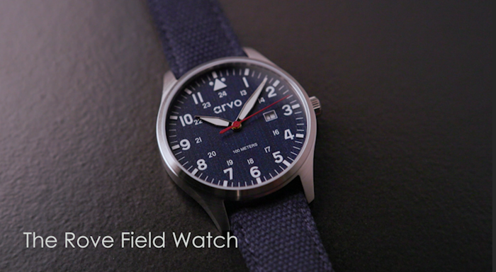 Load video: Video of an Arvo Rove Field Watch with moon white face and black canvas band
