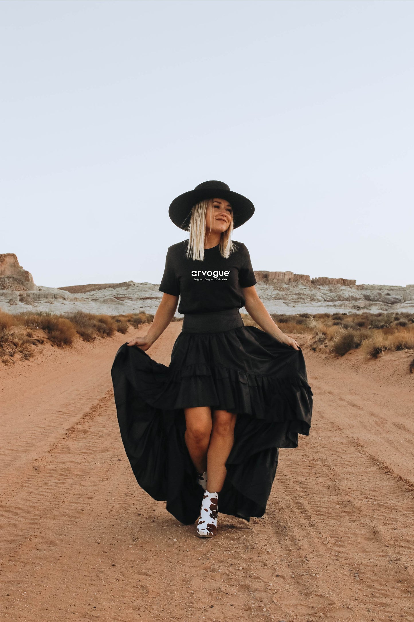 Woman in a black wide brimmed hat wearing a black Arvogue Ultra Soft Women's T Shirt
