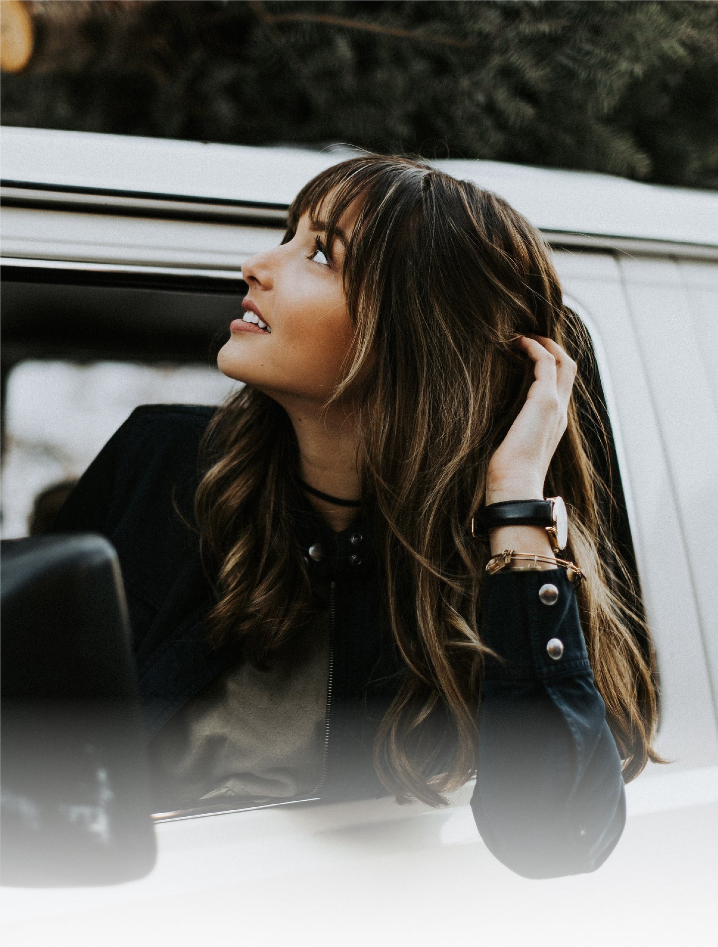 Woman wearing an Arvo Time Sawyer Watch. She is looking out a van window.