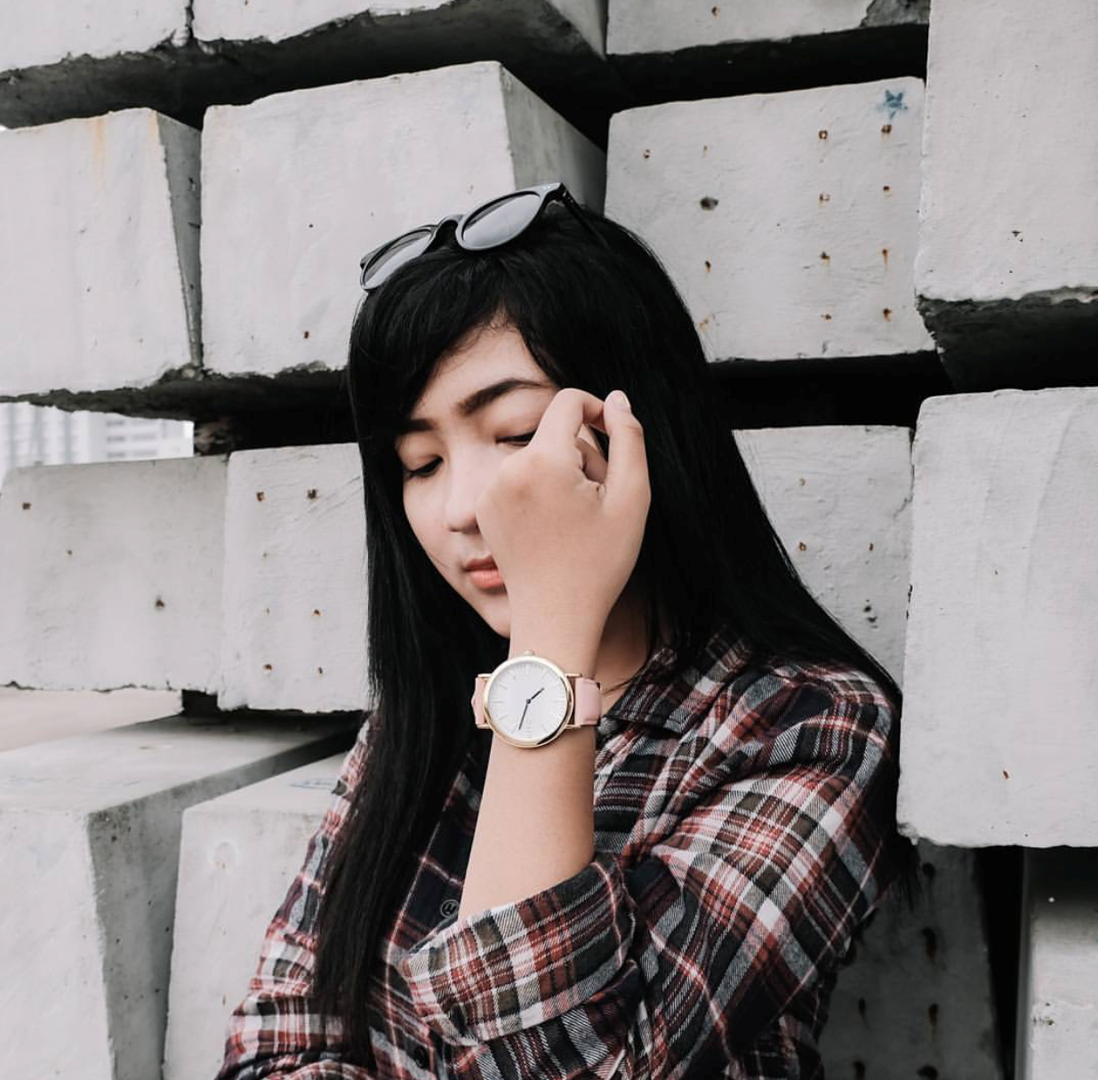 Asian woman wearing a White Time Sawyer watch for women with a pink leather band