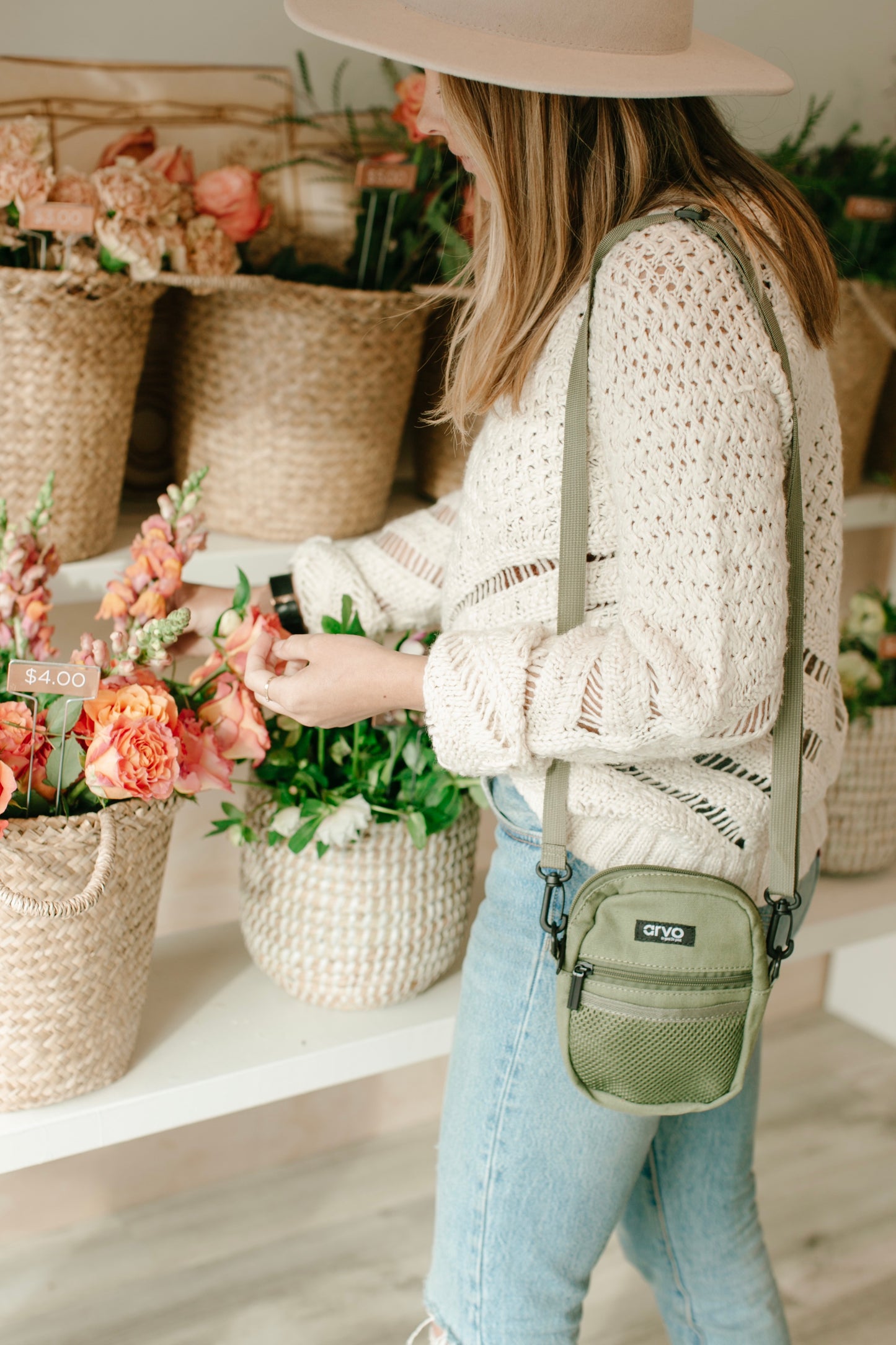 women shopping carrying a willow green Arvo Fanny 