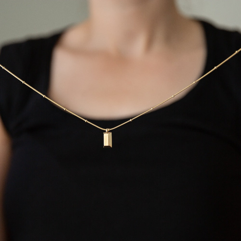 Arvo gold brick on a gold chain necklace