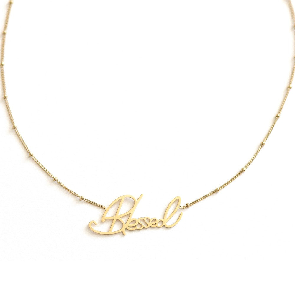 Arvo gold blessed necklace on a white background