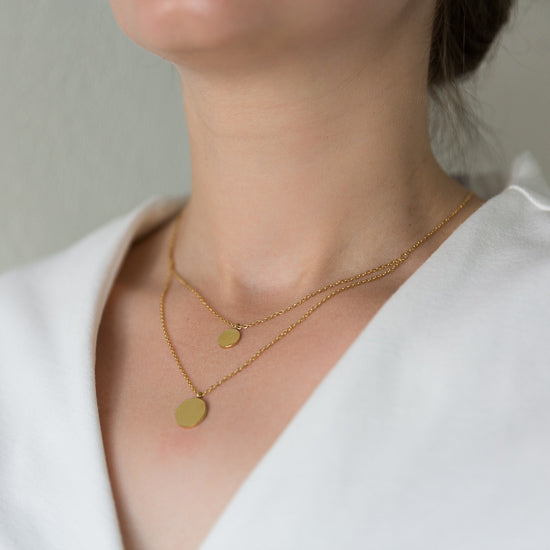 woman wearing an Arvo Layered Double Disc Necklace