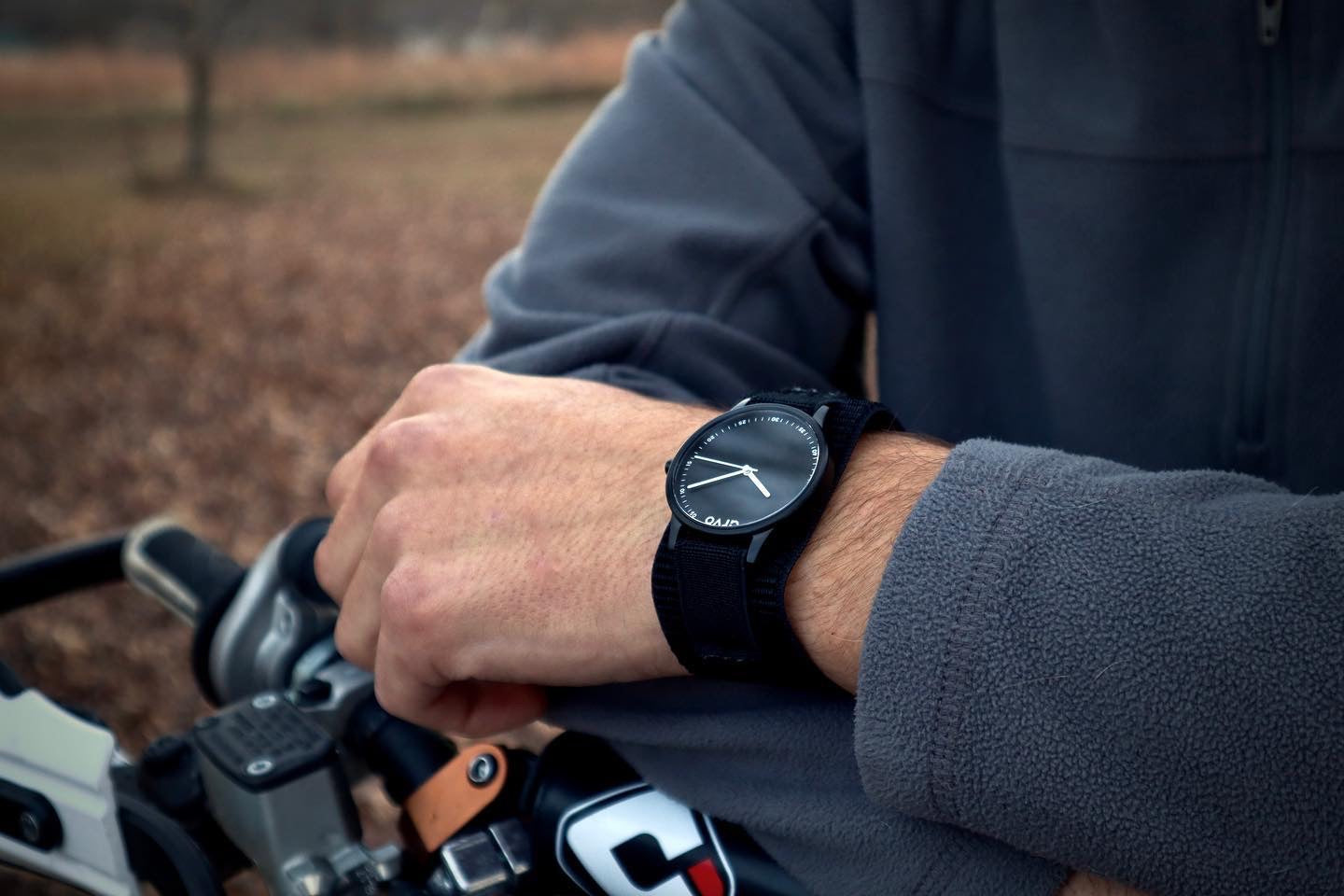 man on motorcycle wearing an Arvo Time Traveler Sport Watch for men black sport strap